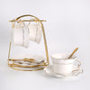 Élégance dorée : offrez-vous un thé luxueux avec notre ensemble de théière en céramique dorée et verre.